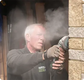 Photography of Worker with Grander by Dimension Digital